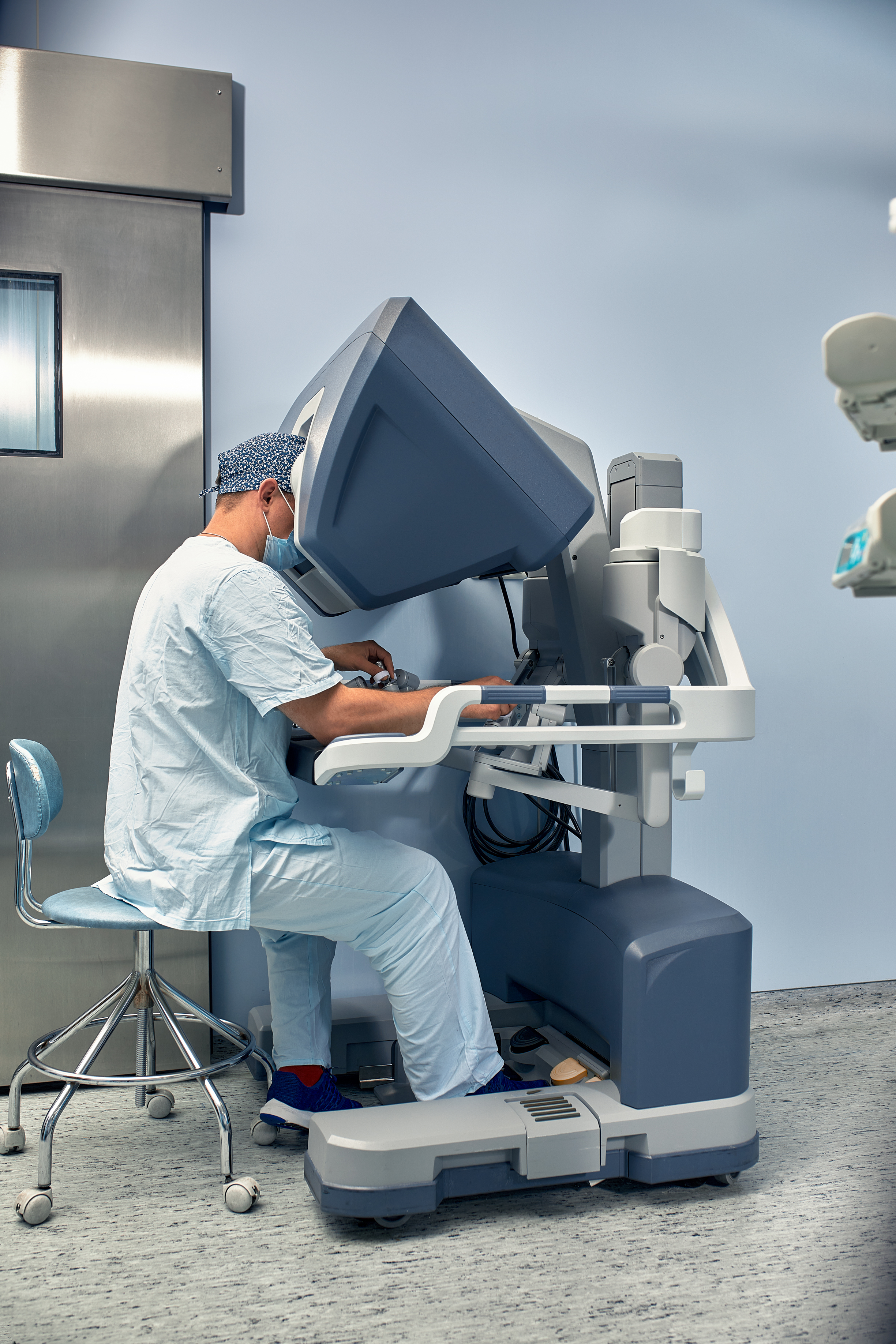 Hands of a surgeon at a computer robot. medical robot. Robotic Surgery.